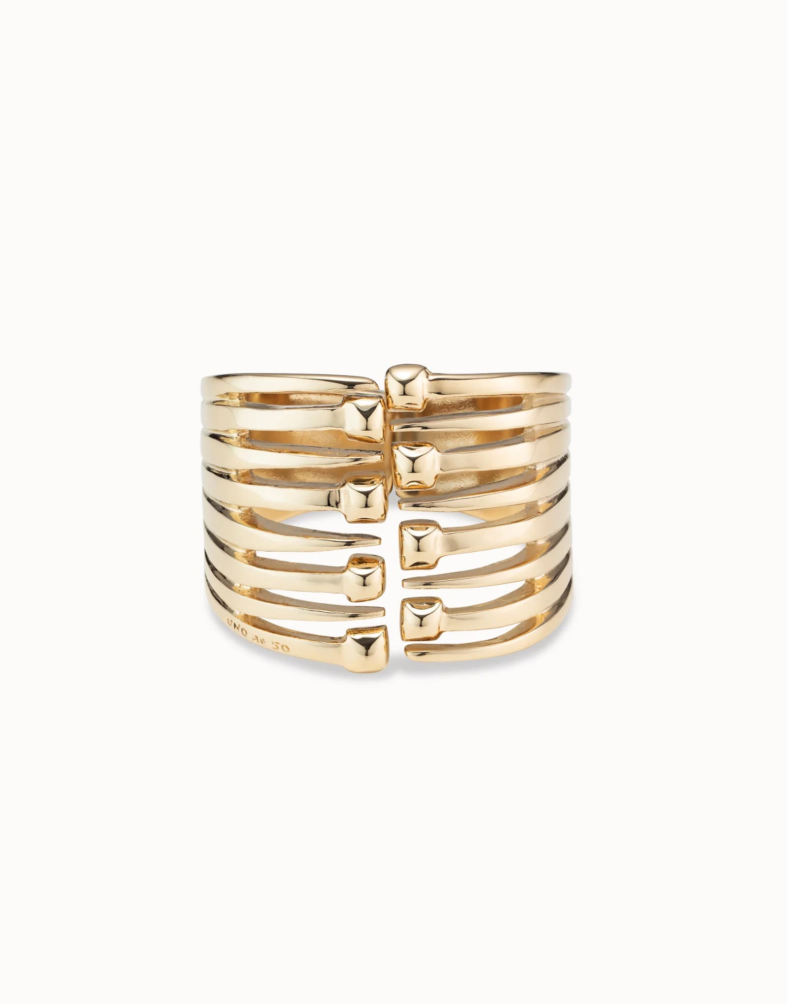 Bangle bracelet with multiple nail heads